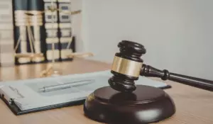 Domestic violence arrest legal process shown through courtroom gavel and case documents in Illinois.