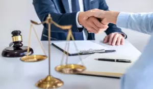 Plea deal negotiation between attorney and client with legal scales and documents in Illinois criminal case setting